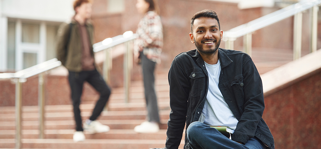 smiling male student utilizing liberty caps flourish coaching enrichment services